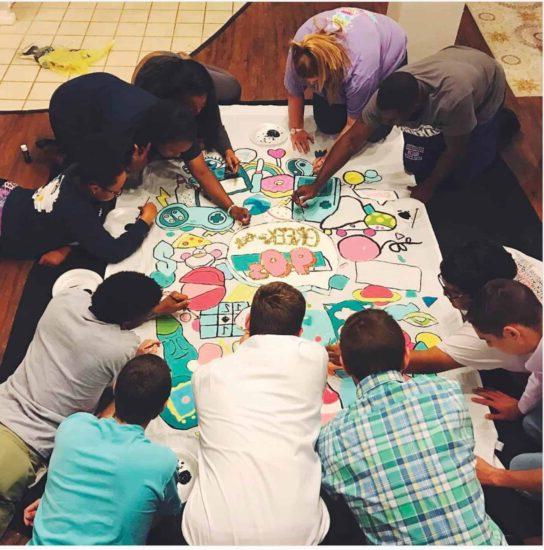 Students coloring together.