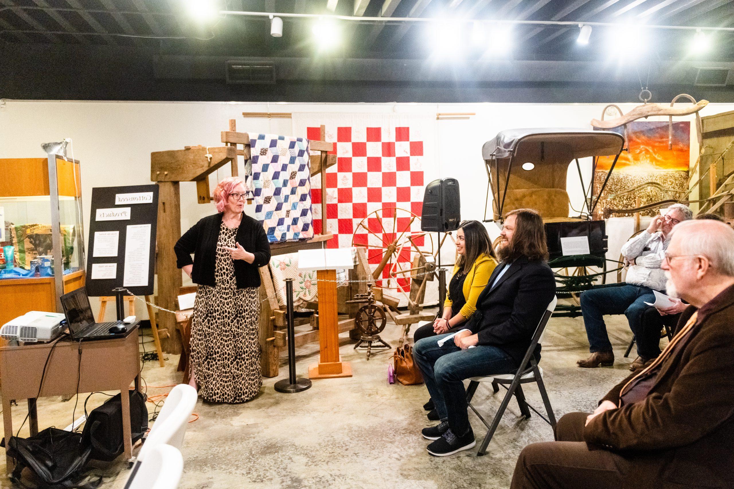 A professor teaching a class about cotton rural history.