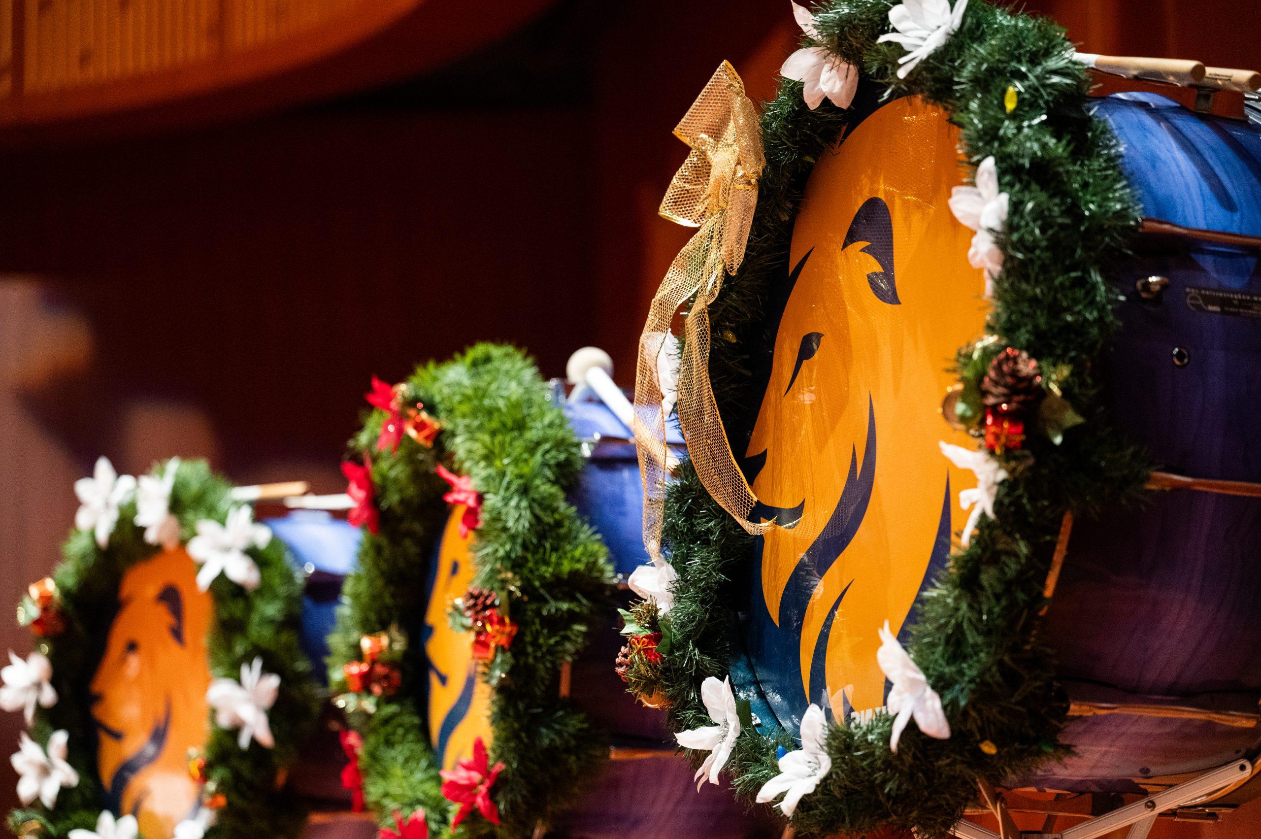 Drums decorated in christmas garland.